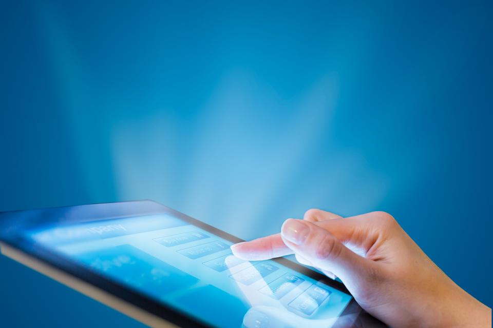 finger on tablet