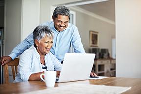 Retired couple using computer